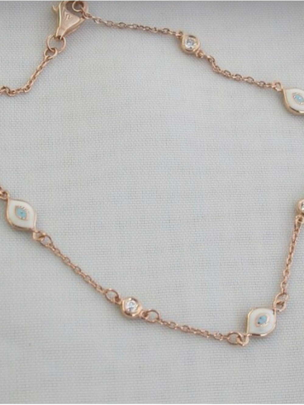 Delicate 14k Rose Gold and diamond Evil Eye Chain Bracelet with White Enamel